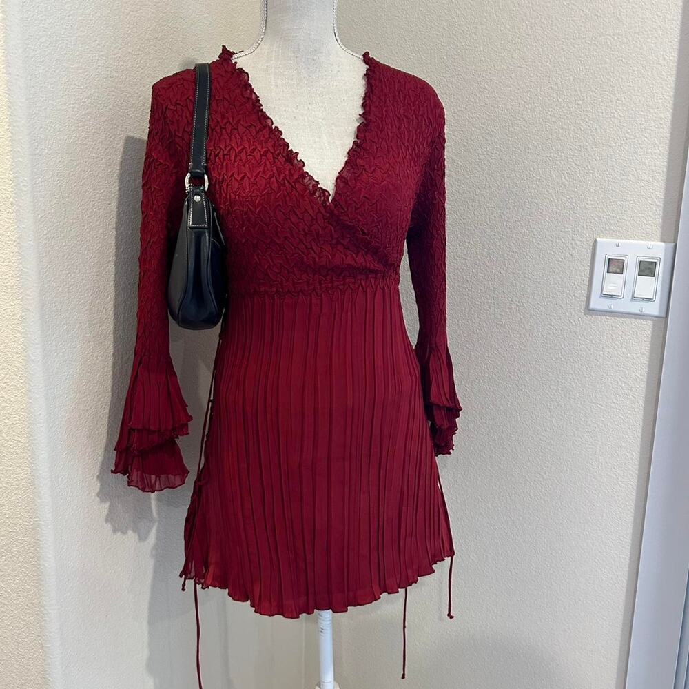 Komarov burgundy top with ruffle top. Size medium